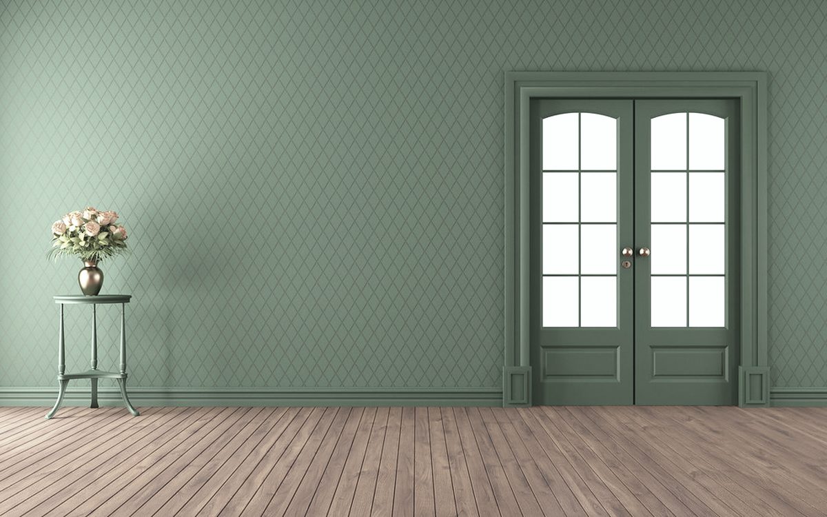 An empty room with a clean wood floor